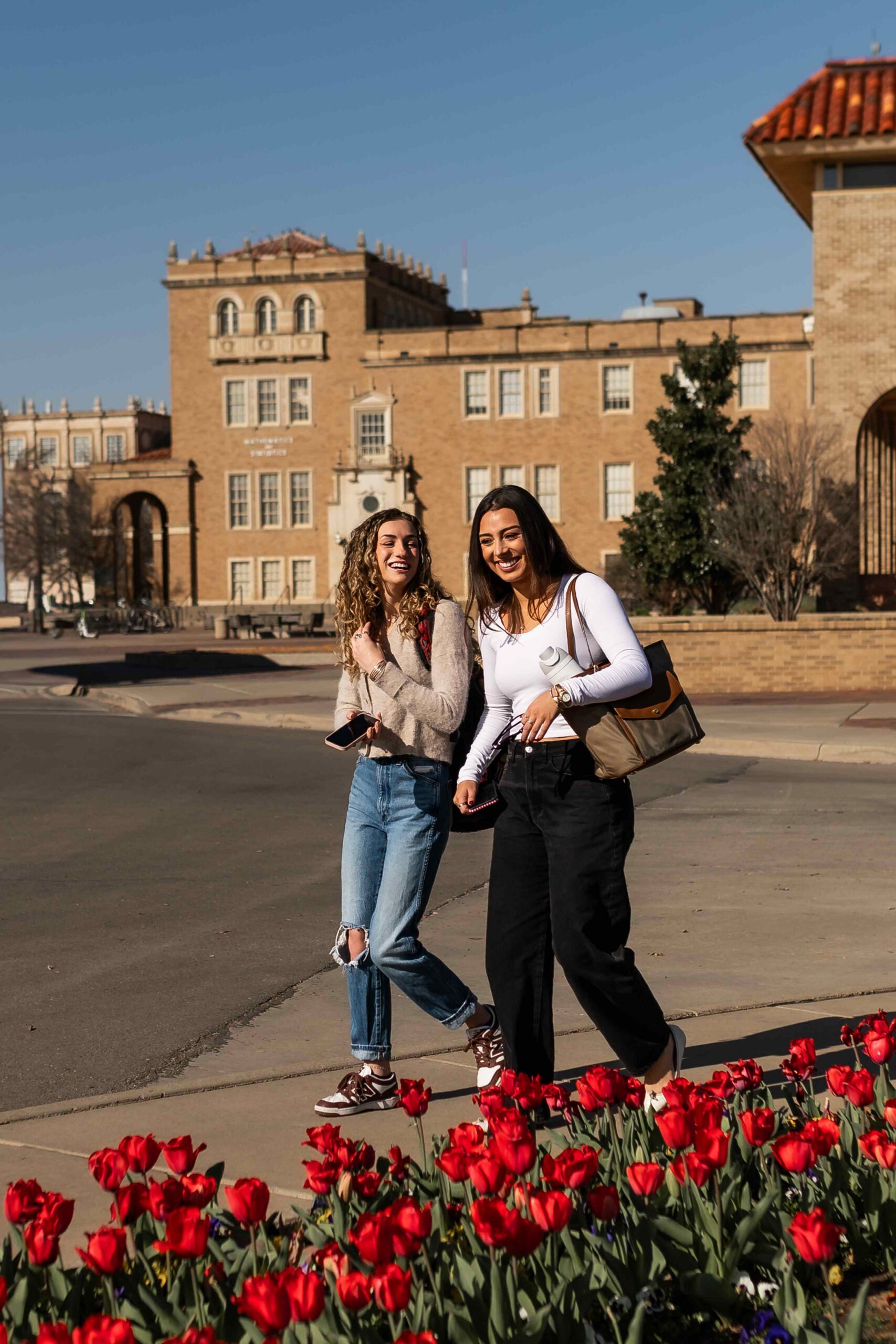 students walking on texas tech campus near troubadour in lubbock tx scaled